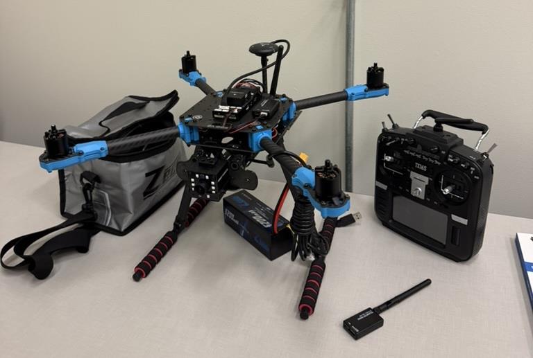 Custom-built research drone with flight controller and remote controller